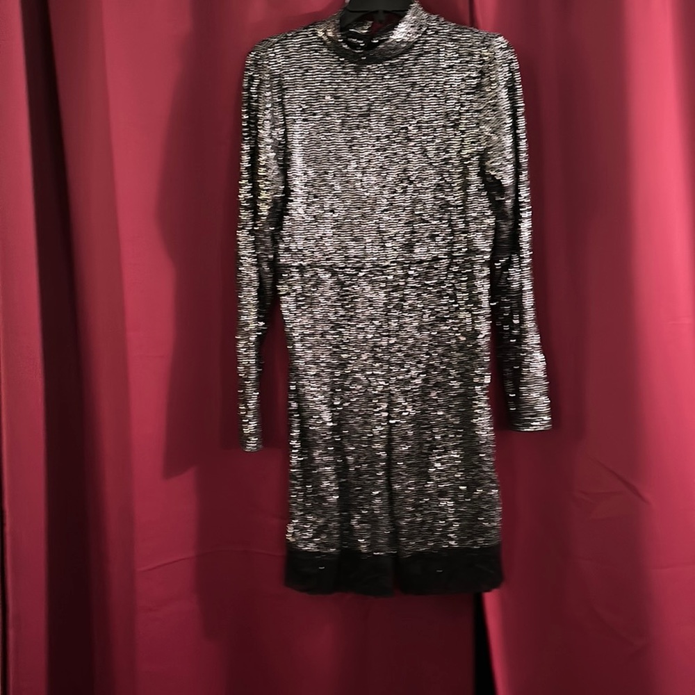 Women’s black sequence evening romper with lace.